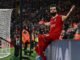 Liverpool's Mohamed Salah celebrates after scoring the opening goal for his side during the English Premier League soccer match against Newcastle at Anfield Stadium in Liverpool, England, on January 1.